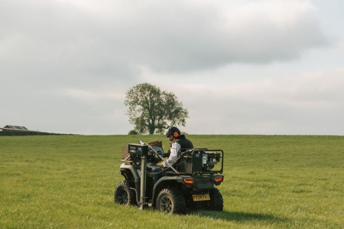 Soil sampling quad bike and coring drill at work on pastureland soil in Eden Valley Cumbria